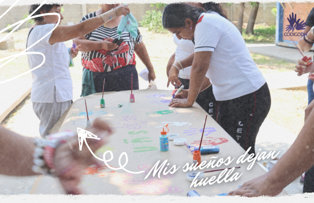 Elaborando el mural "mis sueños dejan huella" con la participación de madres de familia y estudiantes.
